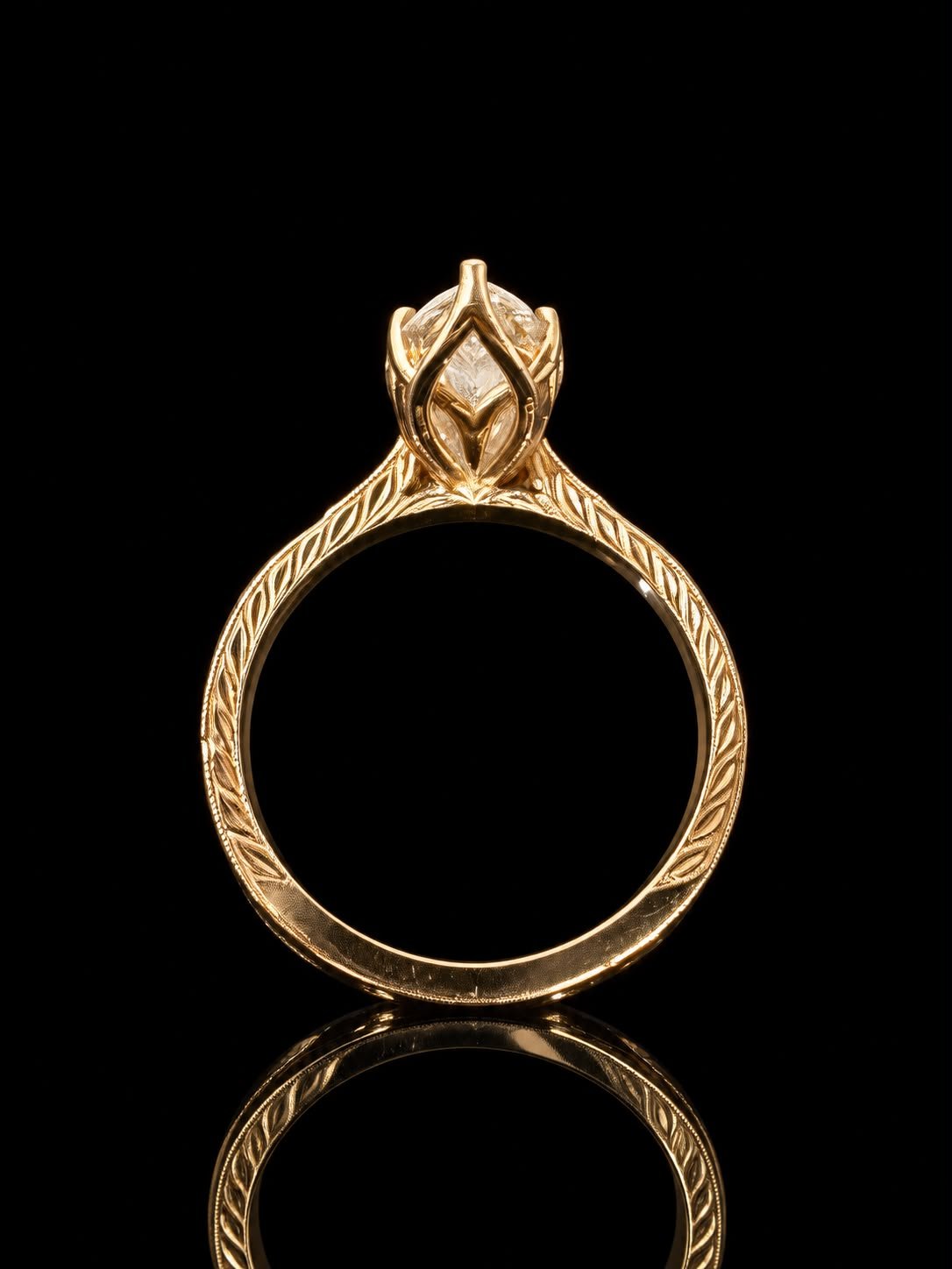 Leaf-engraved ring with a sculpted basket setting