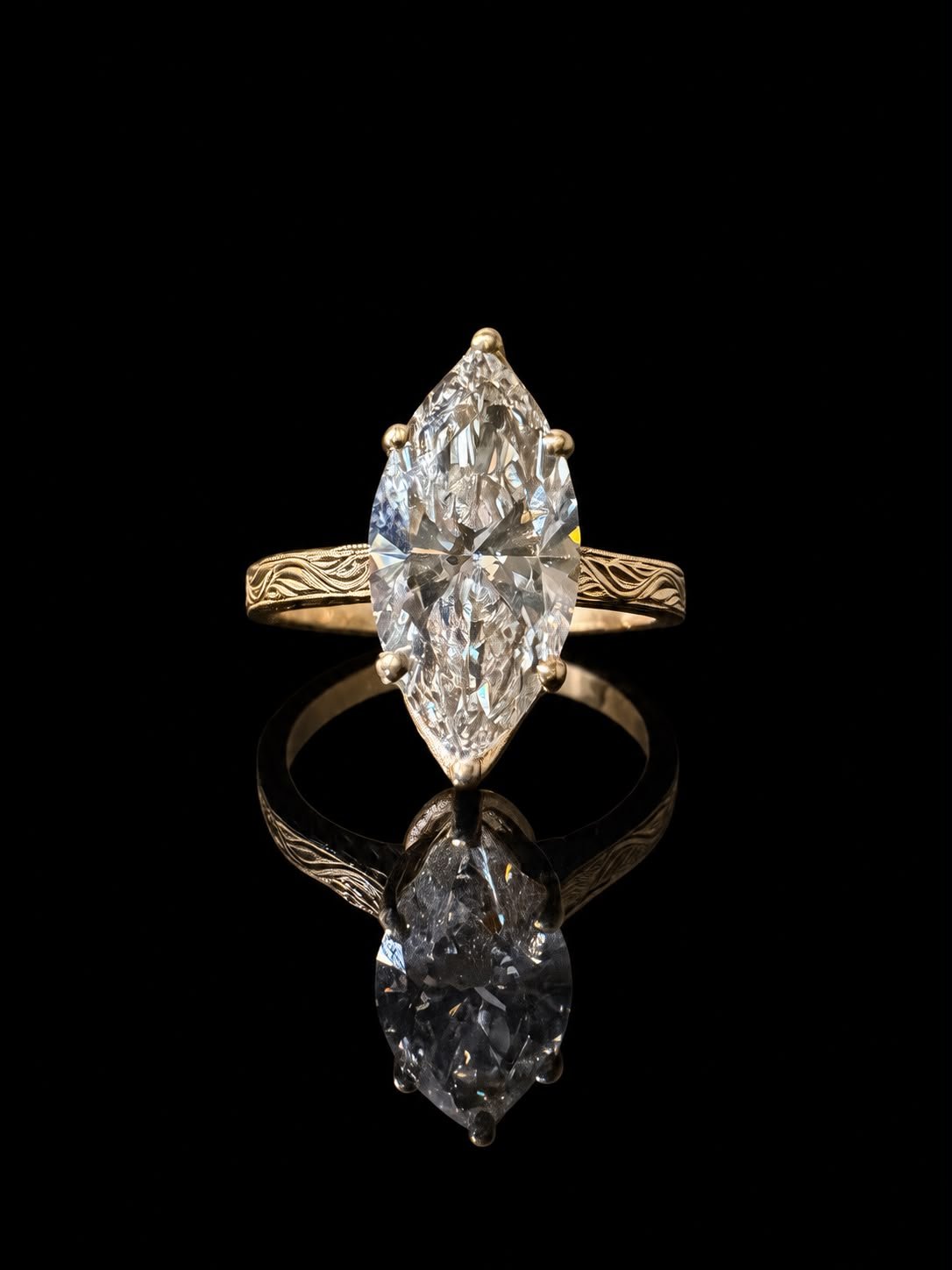 Marquise solitaire ring with wave engraving